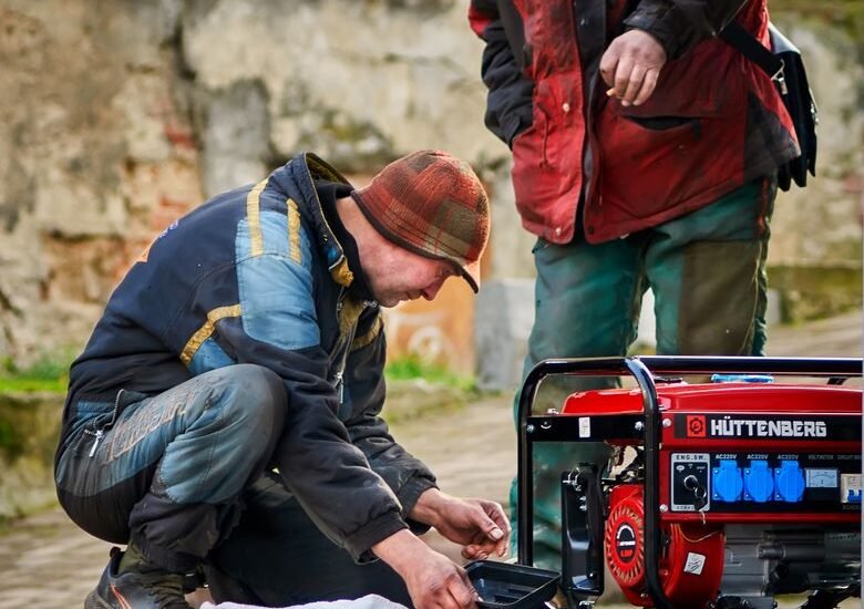 A man examines a generator, illustrating the concept of generator harmonic distortion.